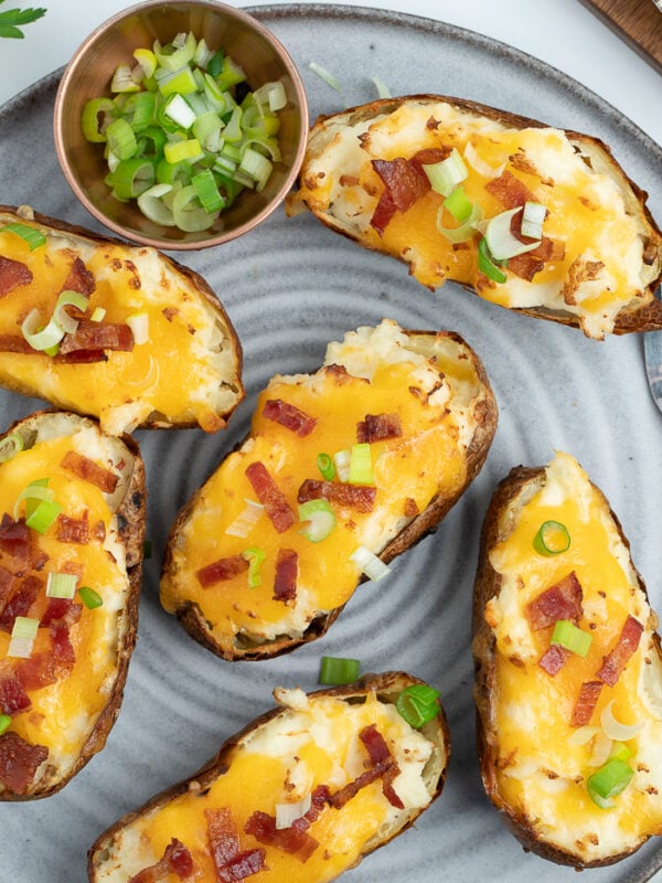 a grey plate with air fryer twice baked potatoes on it.