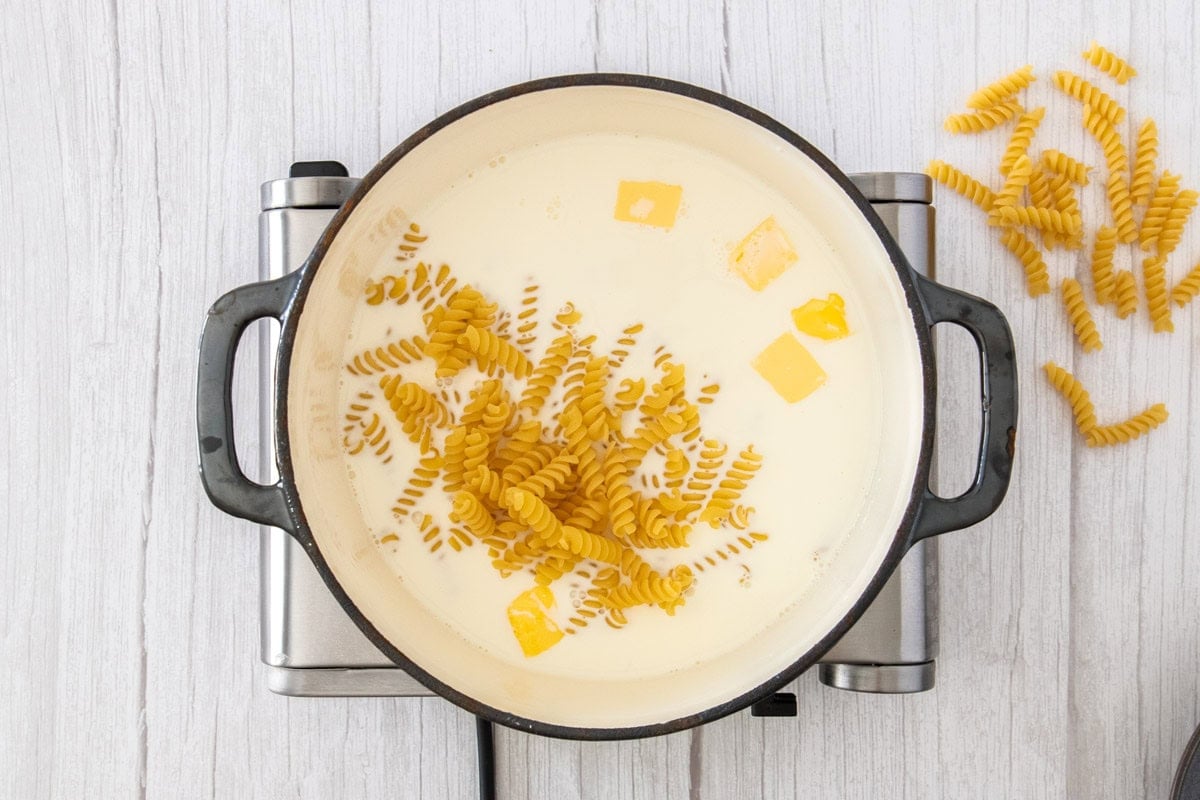 noodles, butter, and milk in a Dutch oven.