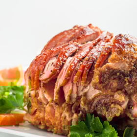 a side photo of a juicy spiral cut ham.