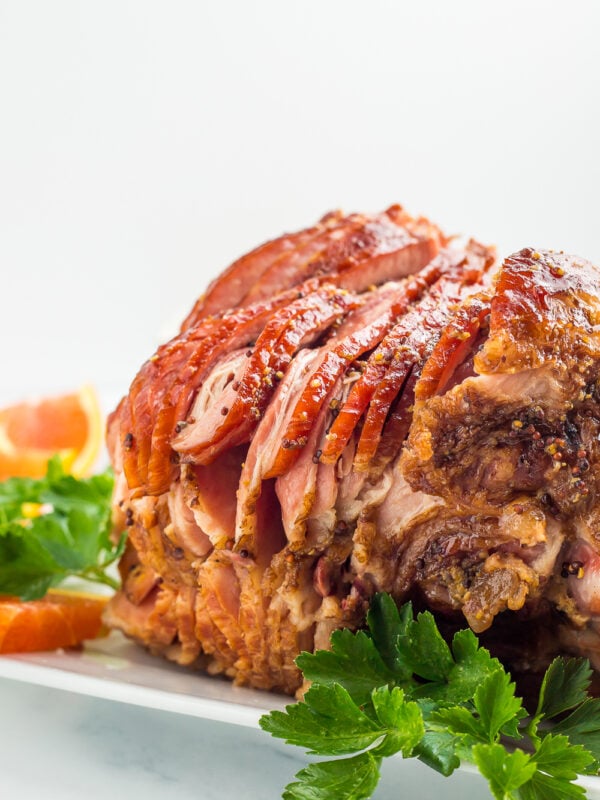 a side photo of a juicy spiral cut ham.