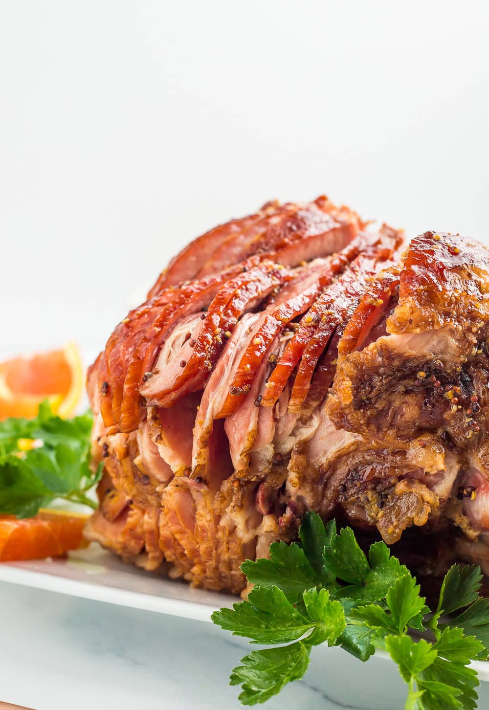 a side photo of a juicy spiral cut ham.