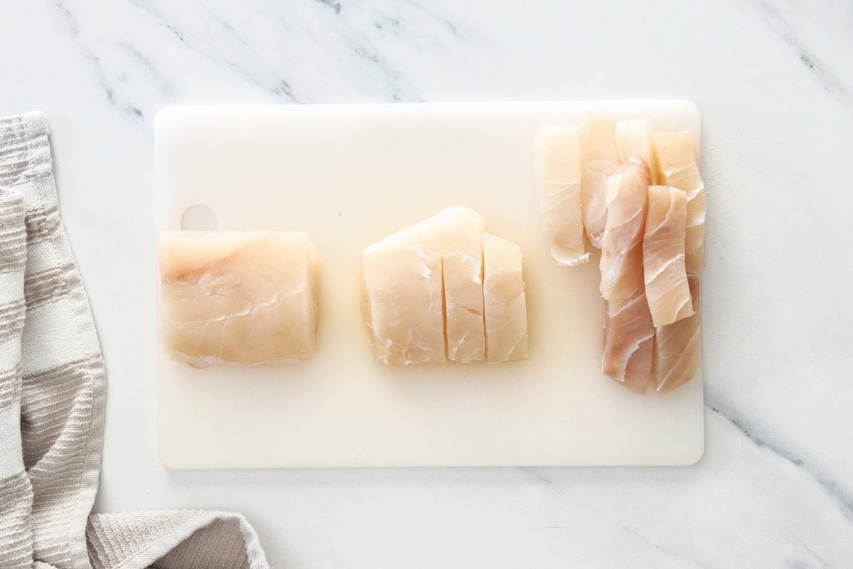 slices of mahi mahi on a cutting board.