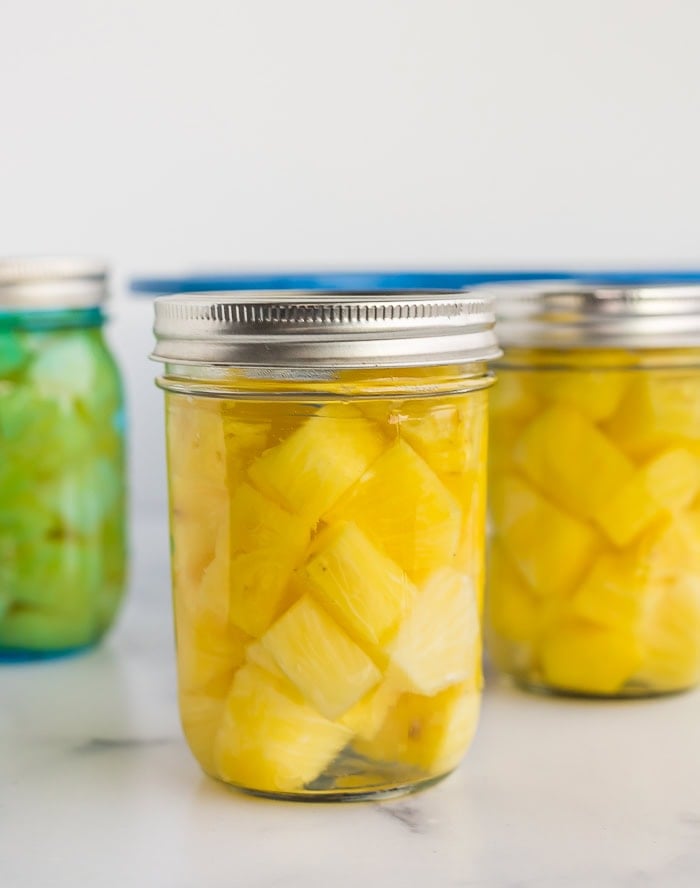 a canning jar with chunks of pineapple.