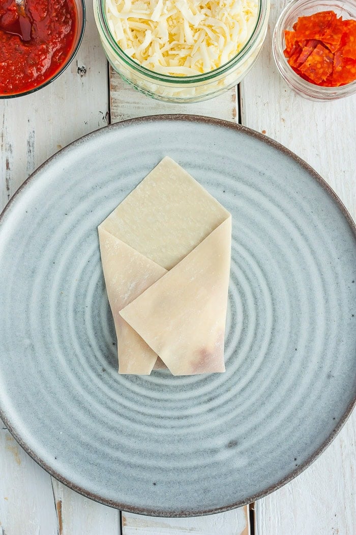 a photo showing step 6 in how to fold a won ton wrapper.