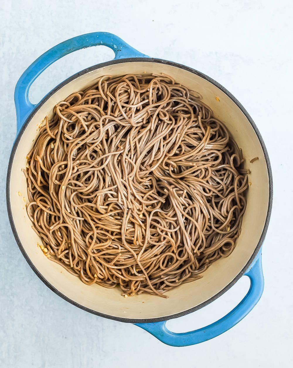 noodles in a blue Dutch oven.