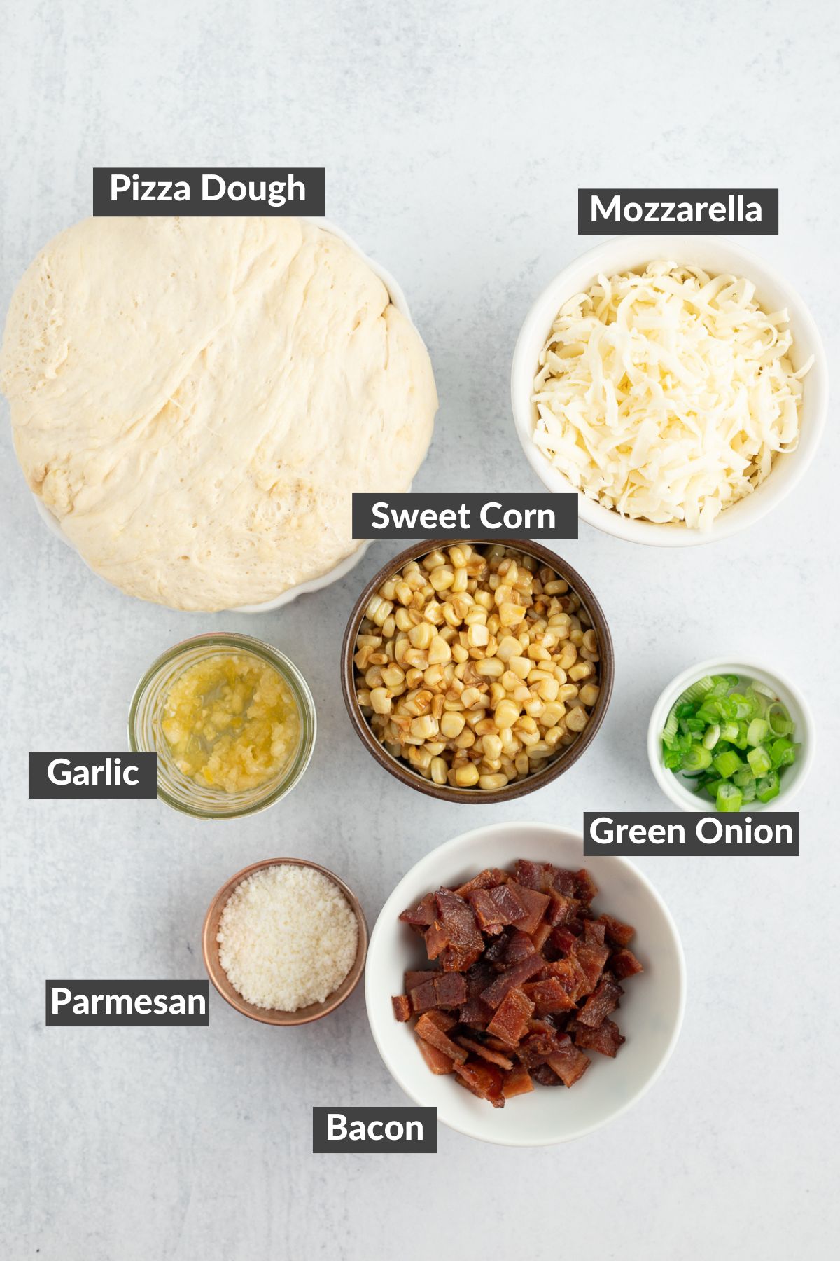 ingredients in bowls on a grey board.