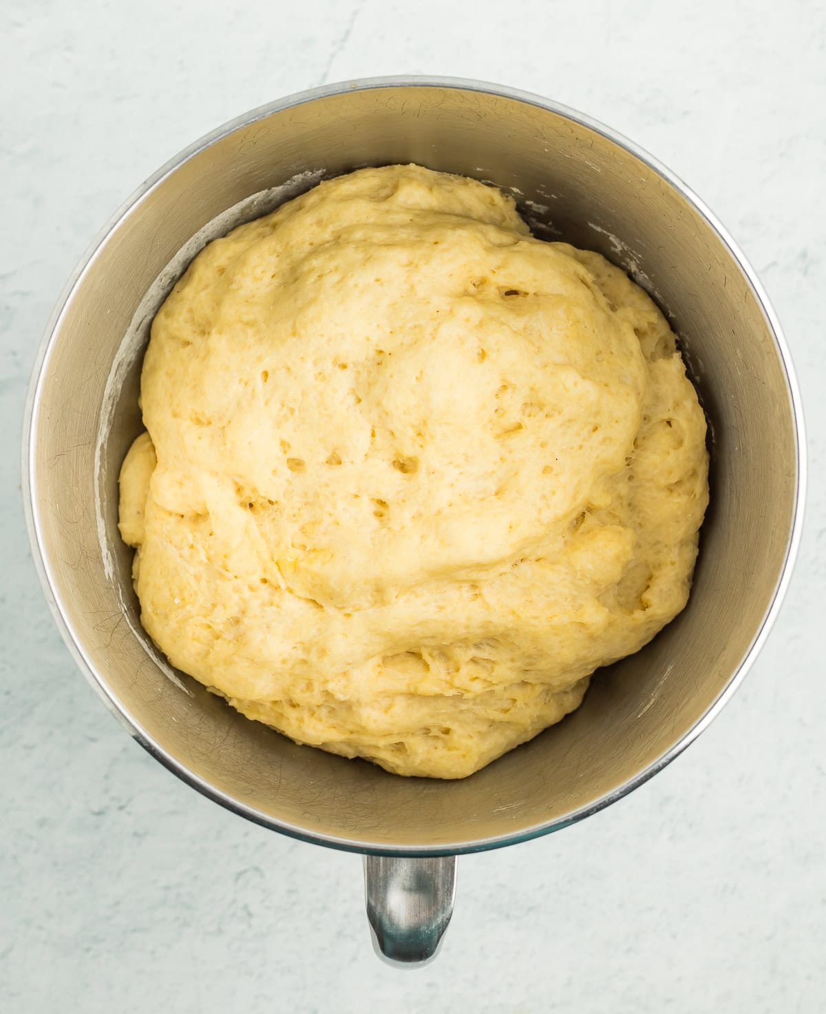 proofed dough in a mixing bowl.