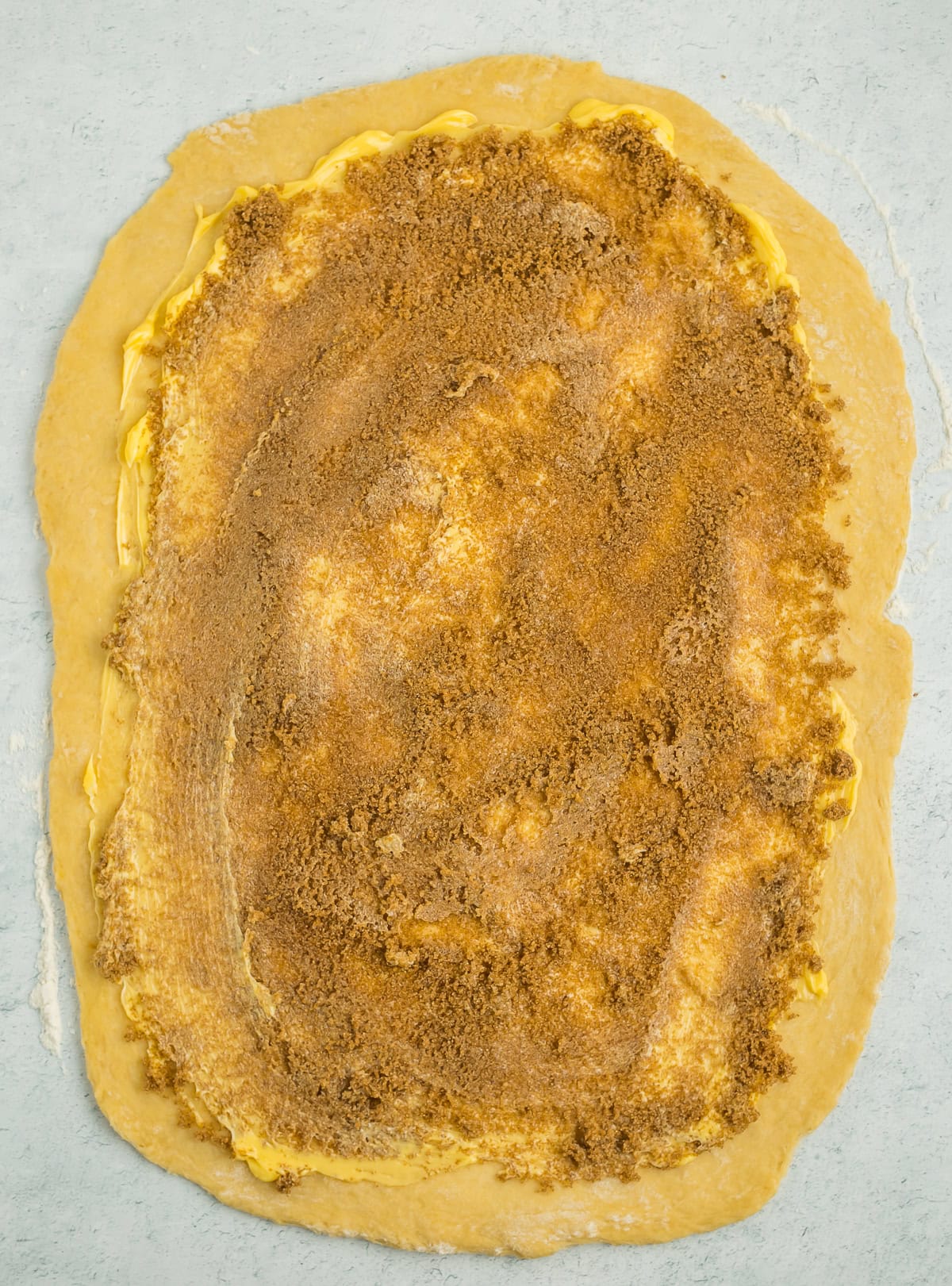 rolled dough with butter and brown sugar.