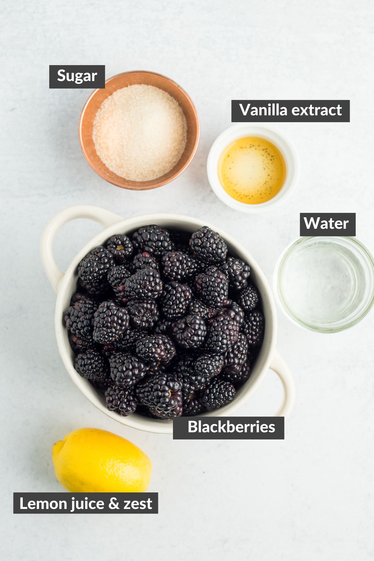 bowls of ingredients on a grey board.