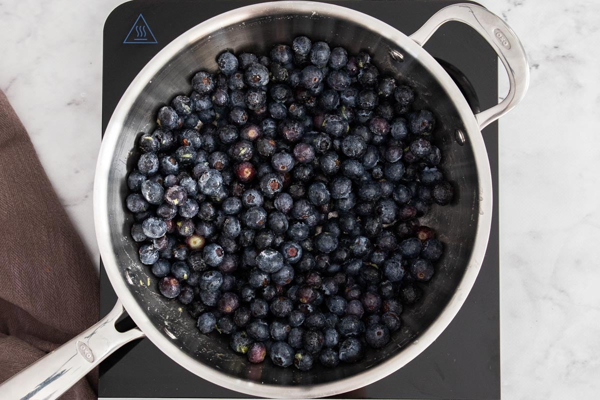 a saucepan/skillet of fruit.