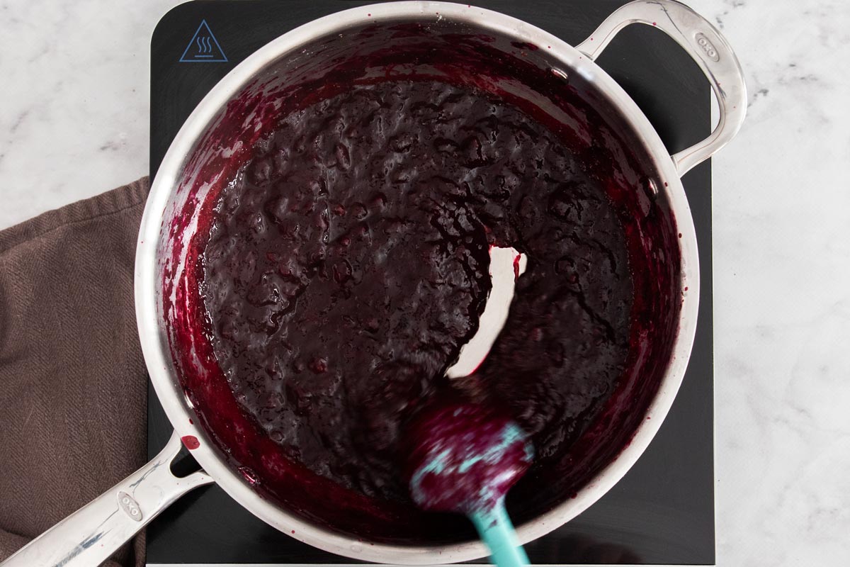fruit cooked down in a skillet.