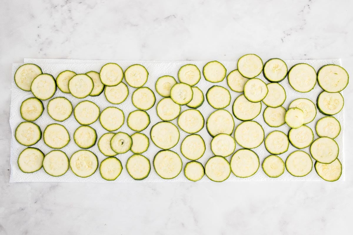 slices of summer squash on paper towels.