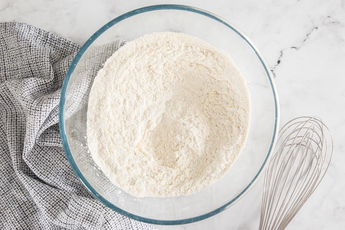 flour and other ingredients in a glass bowl.