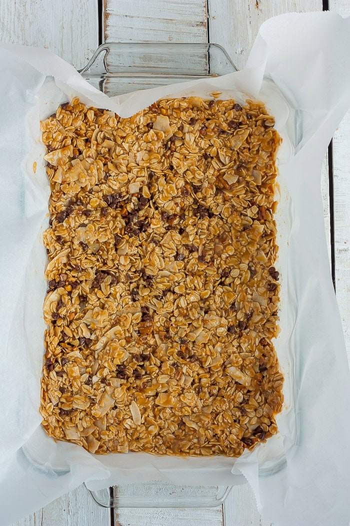homemade granola bars in a glass baking dish.