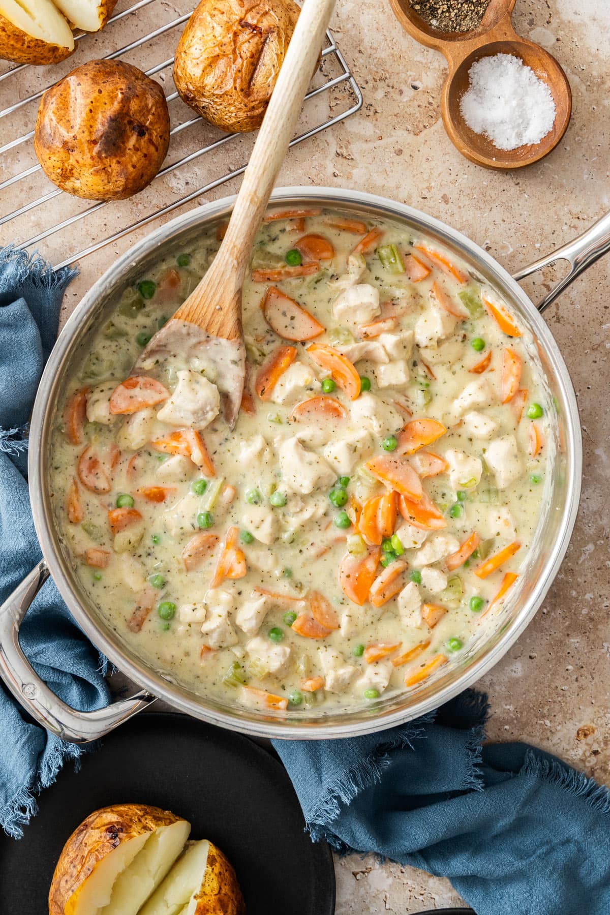veggies in a cream sauce in a stainless skillet.