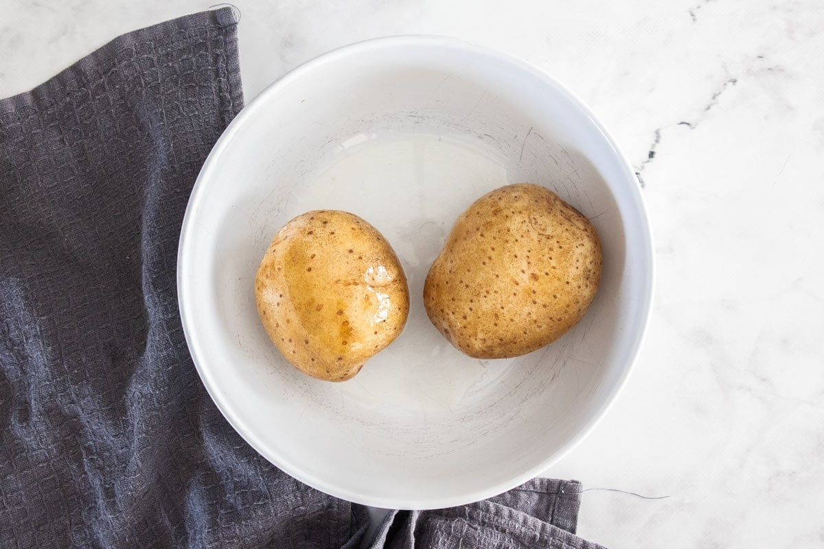 two potatoes in a bowl.