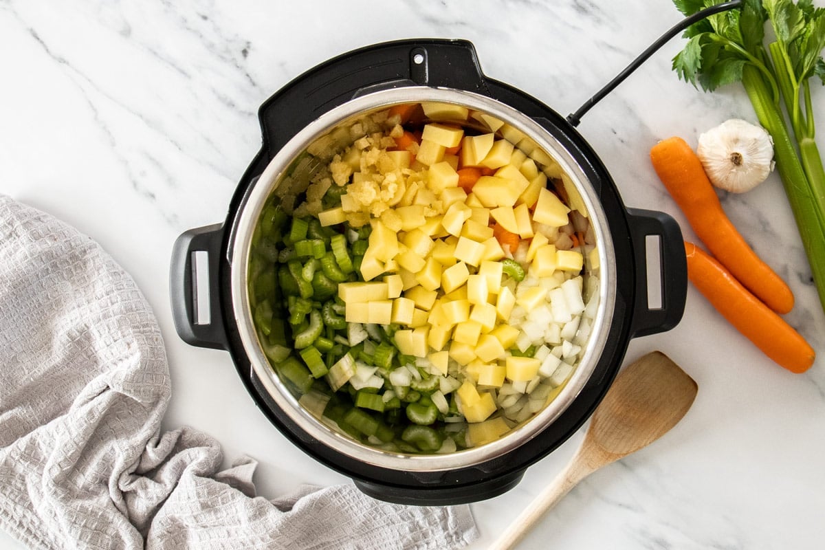 uncooked ingredients in a pressure cooker.