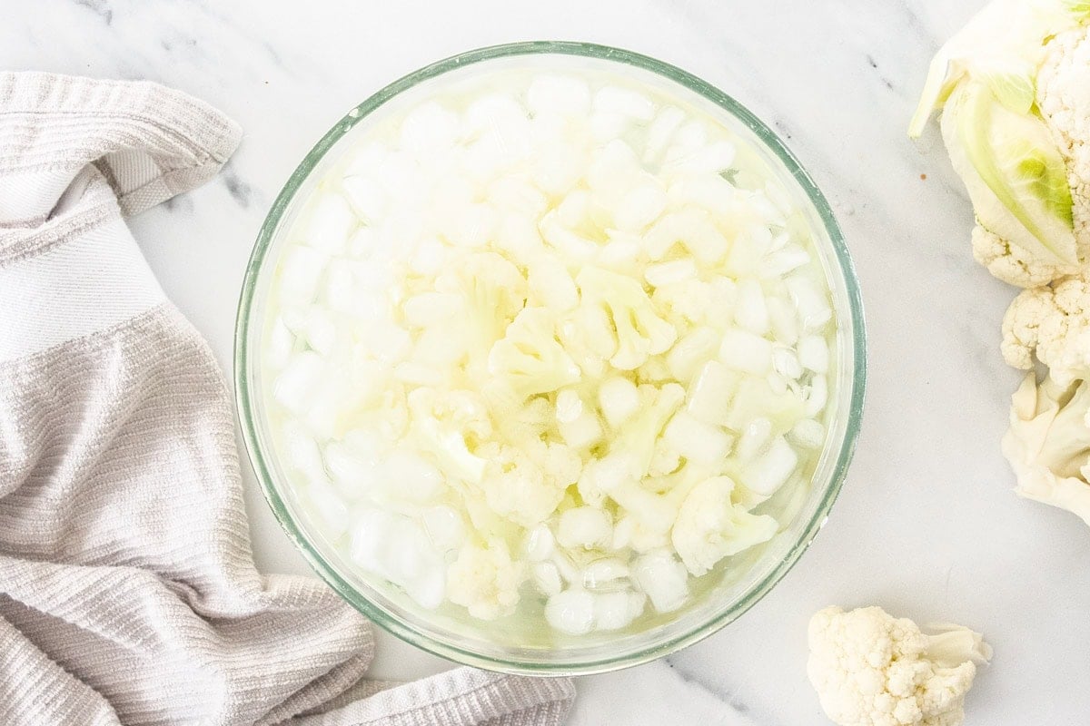 cauliflower florets in a glass bowl.