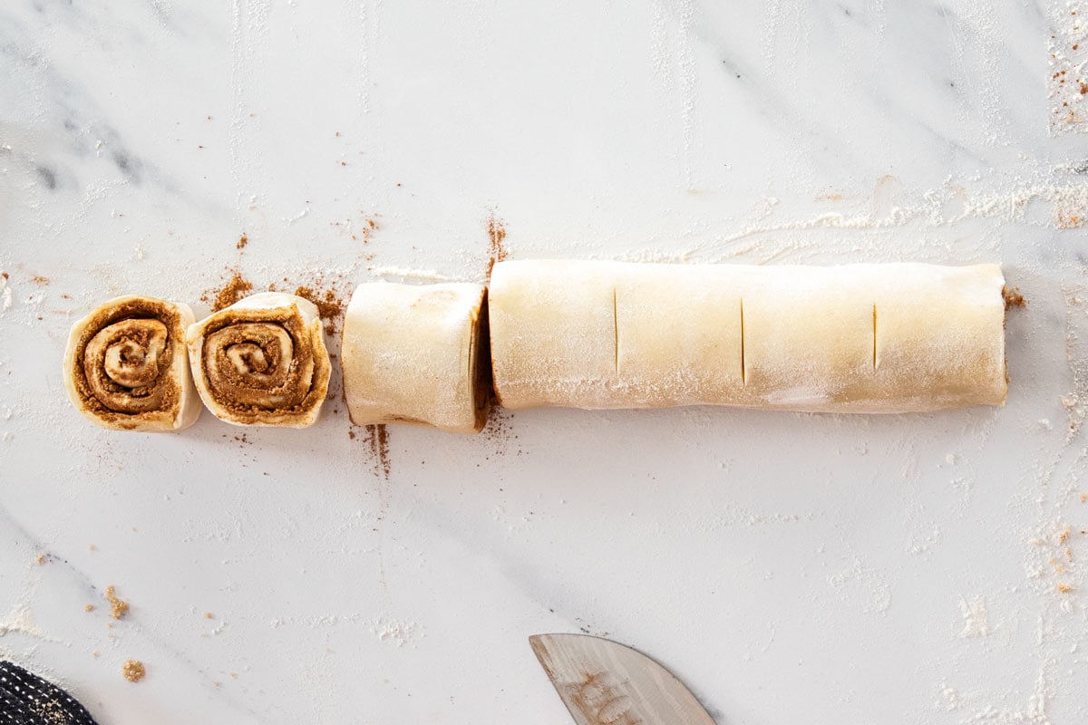 a roll of unbaked cinnamon rolls.