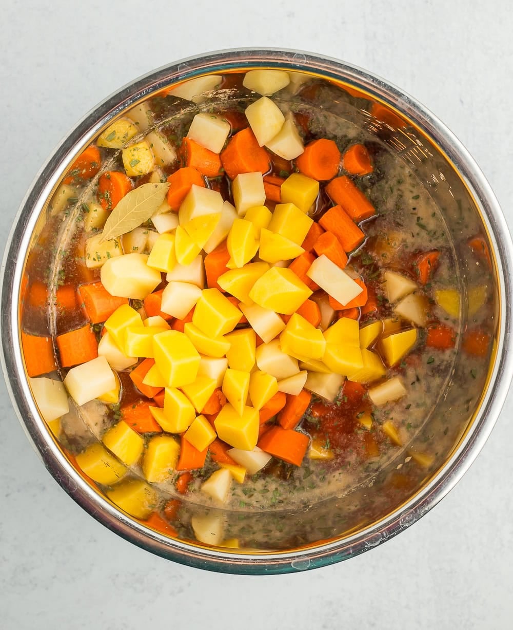 uncooked ingredients in a pressure cooker.