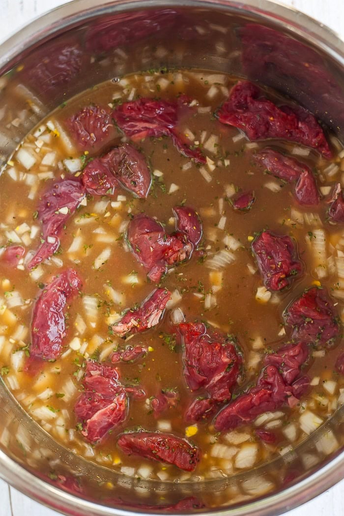 ingredients and beef tips in an Instant Pot.