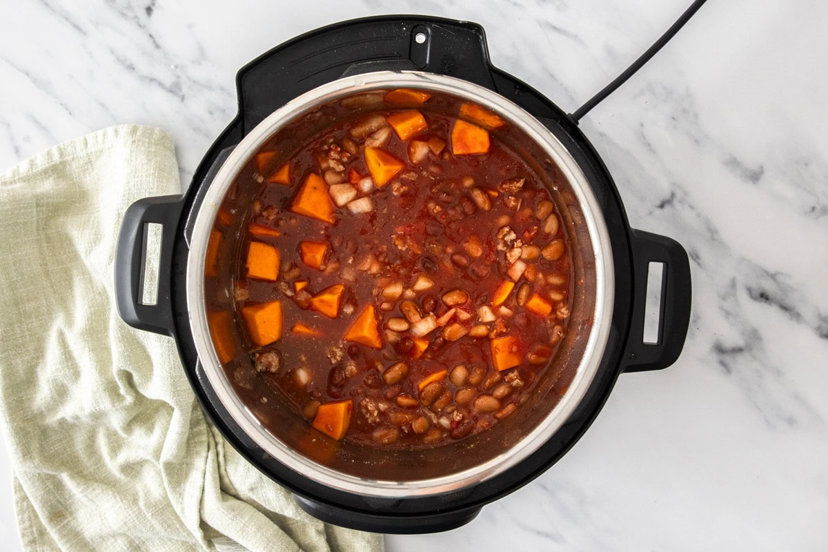 uncooked ingredients in a pressure cooker.