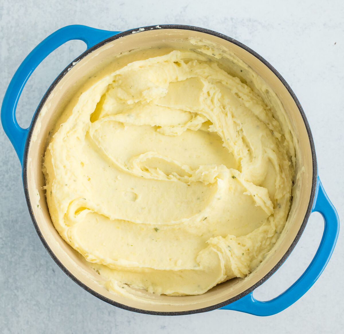 Boursin mashed potatoes in a blue Dutch oven.