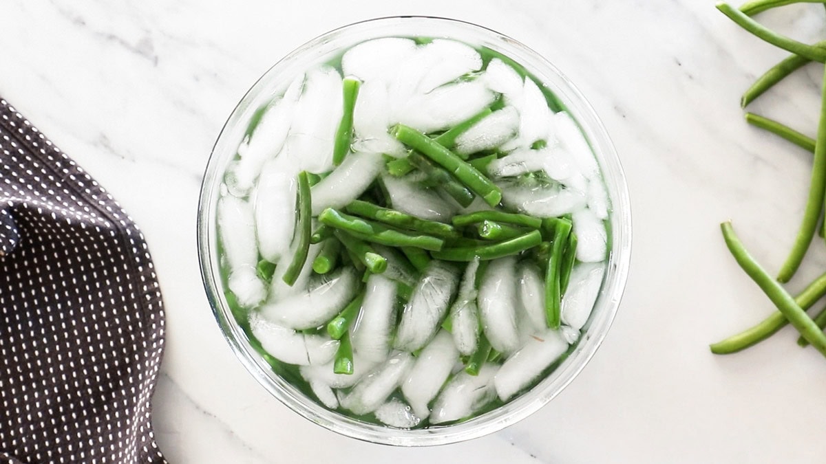 green beans in a bowl of ice.