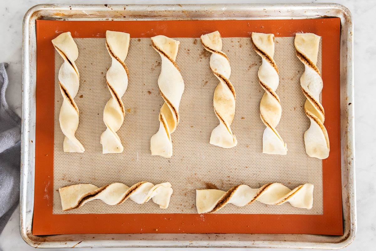 unbaked twisted dough on a baking sheet.