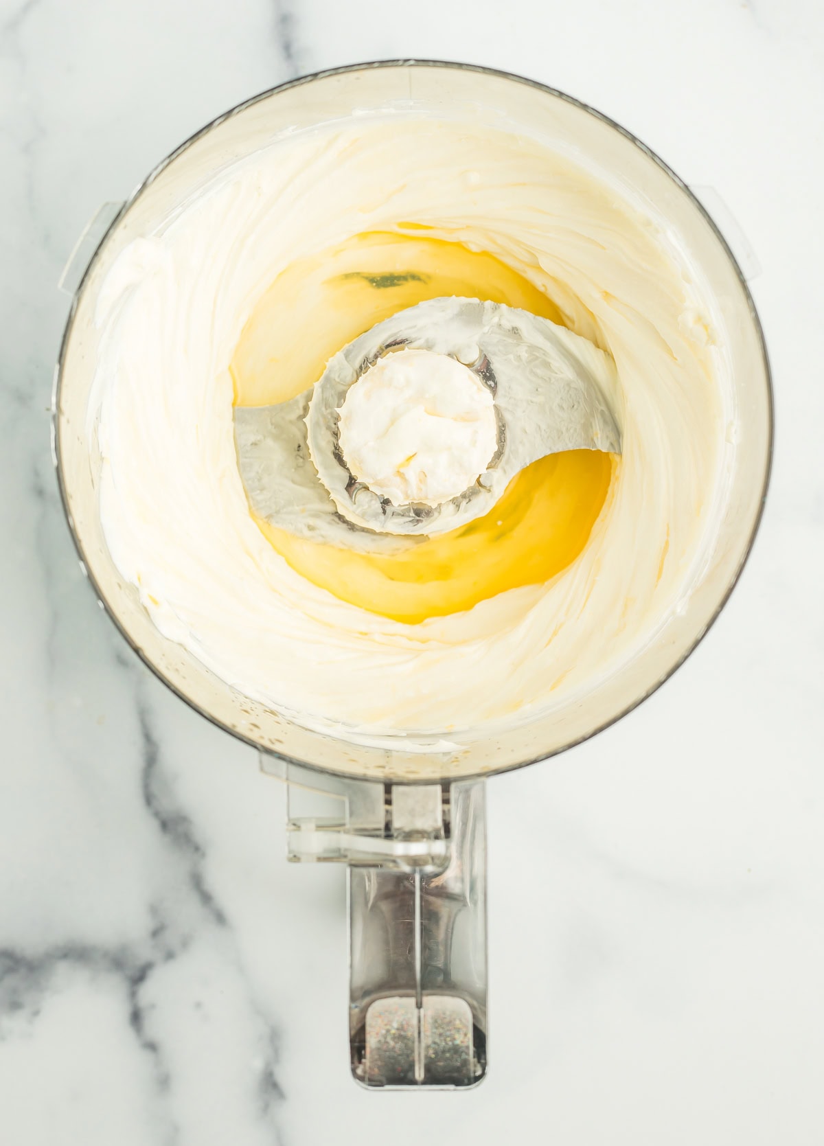 yogurt, cream cheese, and orange juice in a food processor.