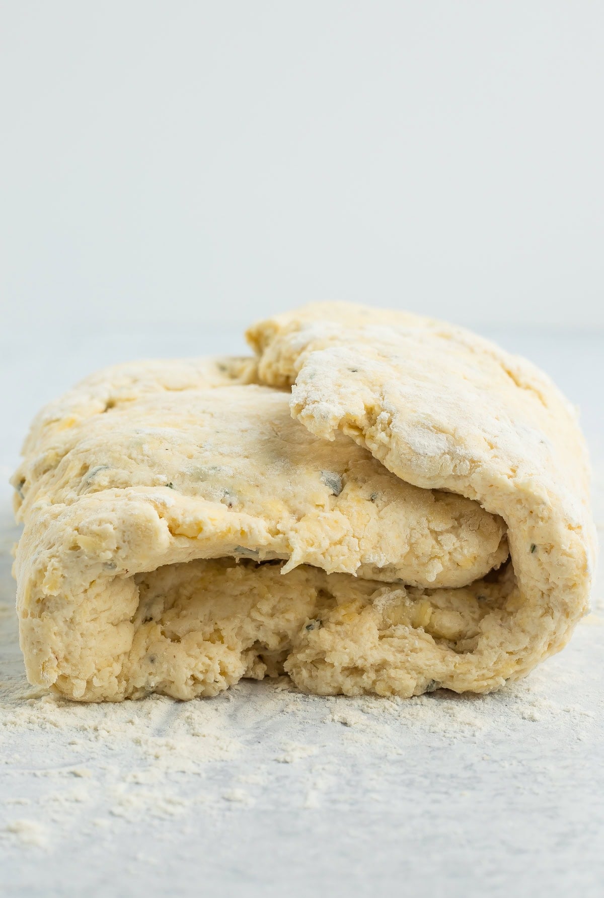 a side profile of unbaked dough folded into thirds