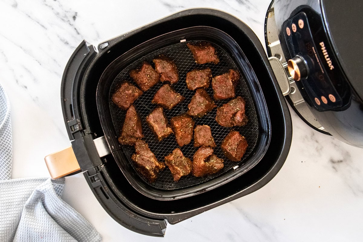 cubes of top sirloin in an air fryer.