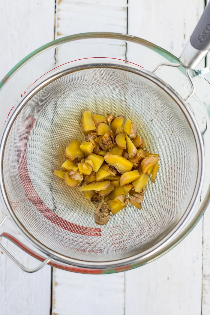ginger in a wire mesh strainer.