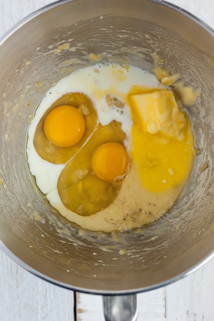eggs, butter, and milk in a mixing bowl.