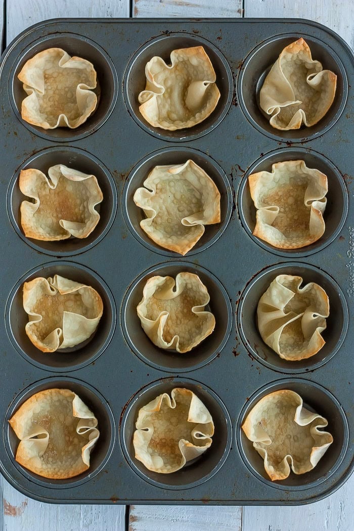 Baked pastry in a muffin tin.
