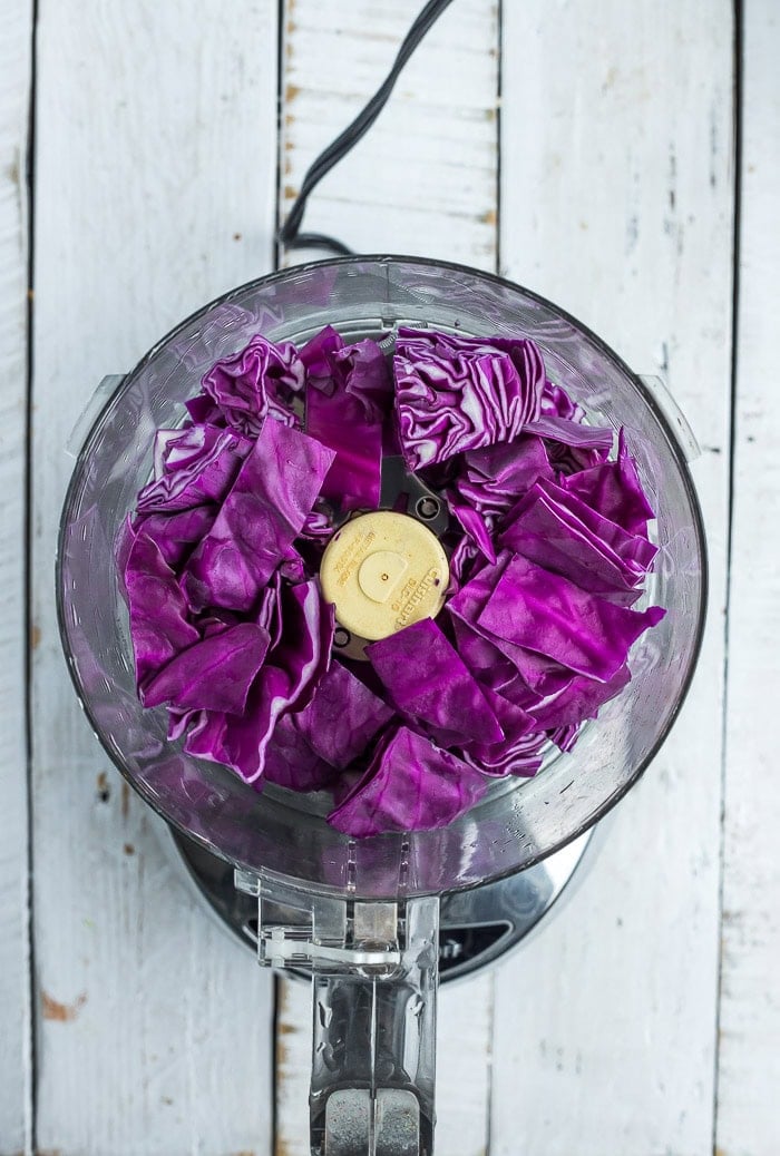 purple cabbage in a food processor before chopping.