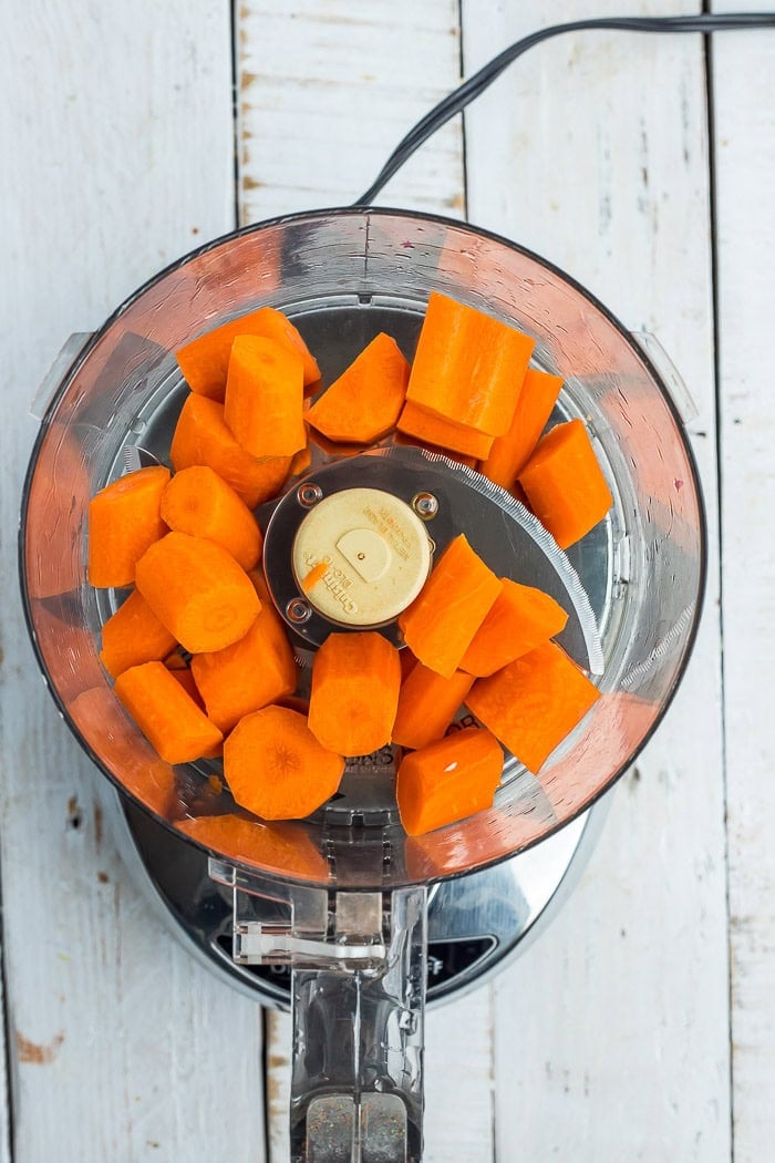 carrots in a food processor before chopping.