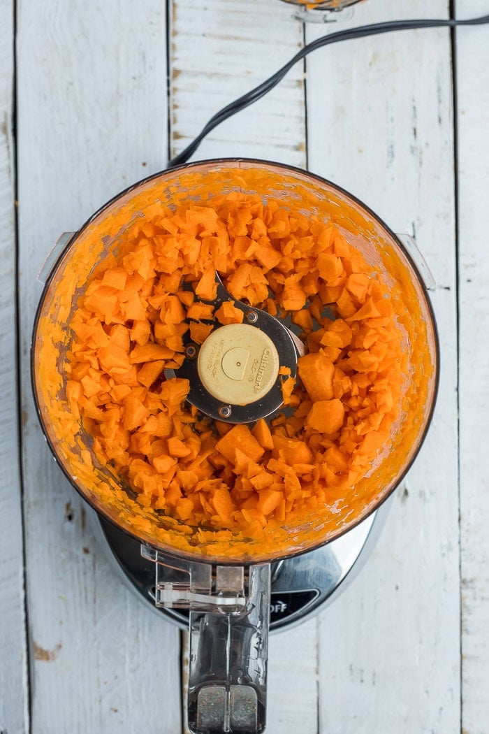 carrots in a food processor after chopping.
