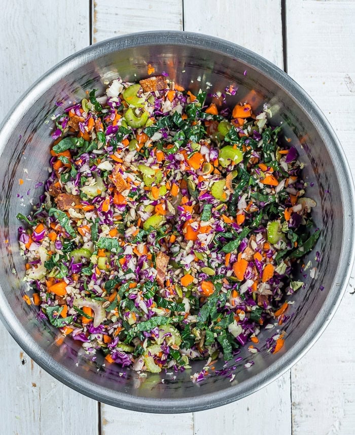 chopped vegetables in a large stainless bowl.