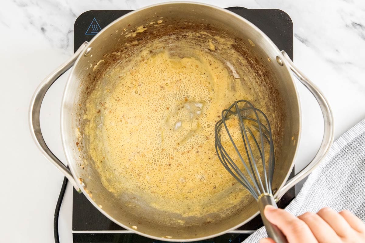 a roux being made in a stockpot.