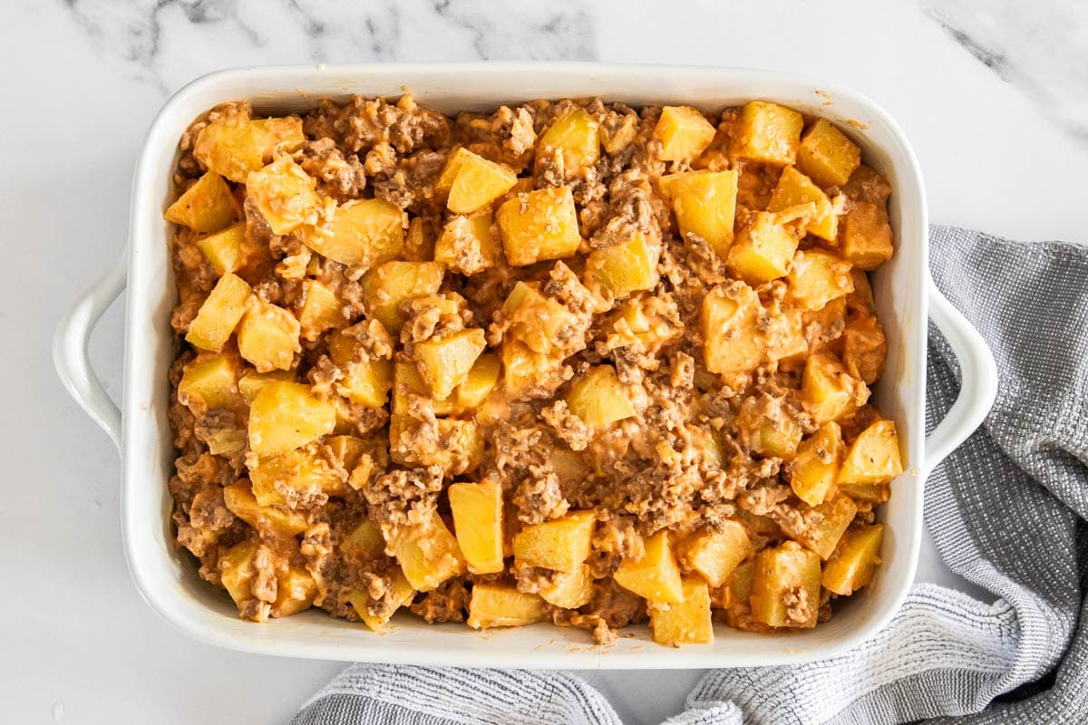 ingredients assembled in a white baking dish.