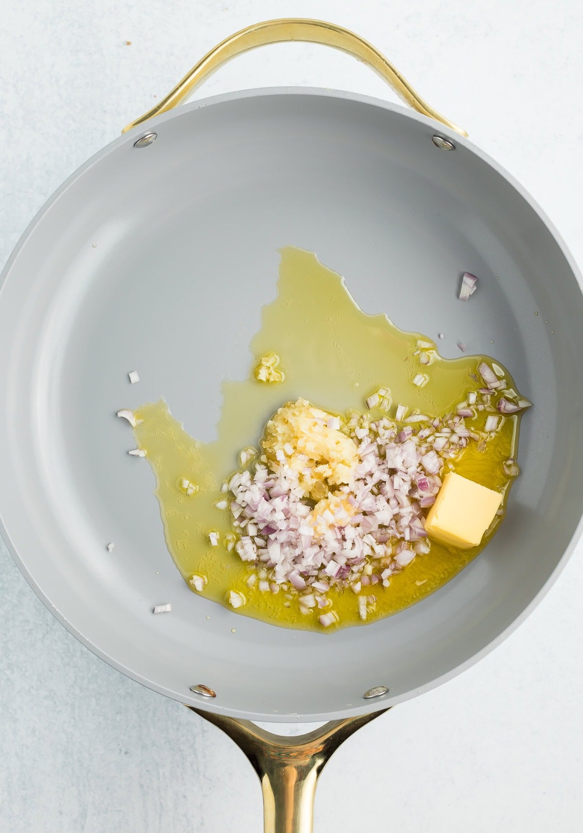 butter, olive oil, shallots, and garlic in a skillet.