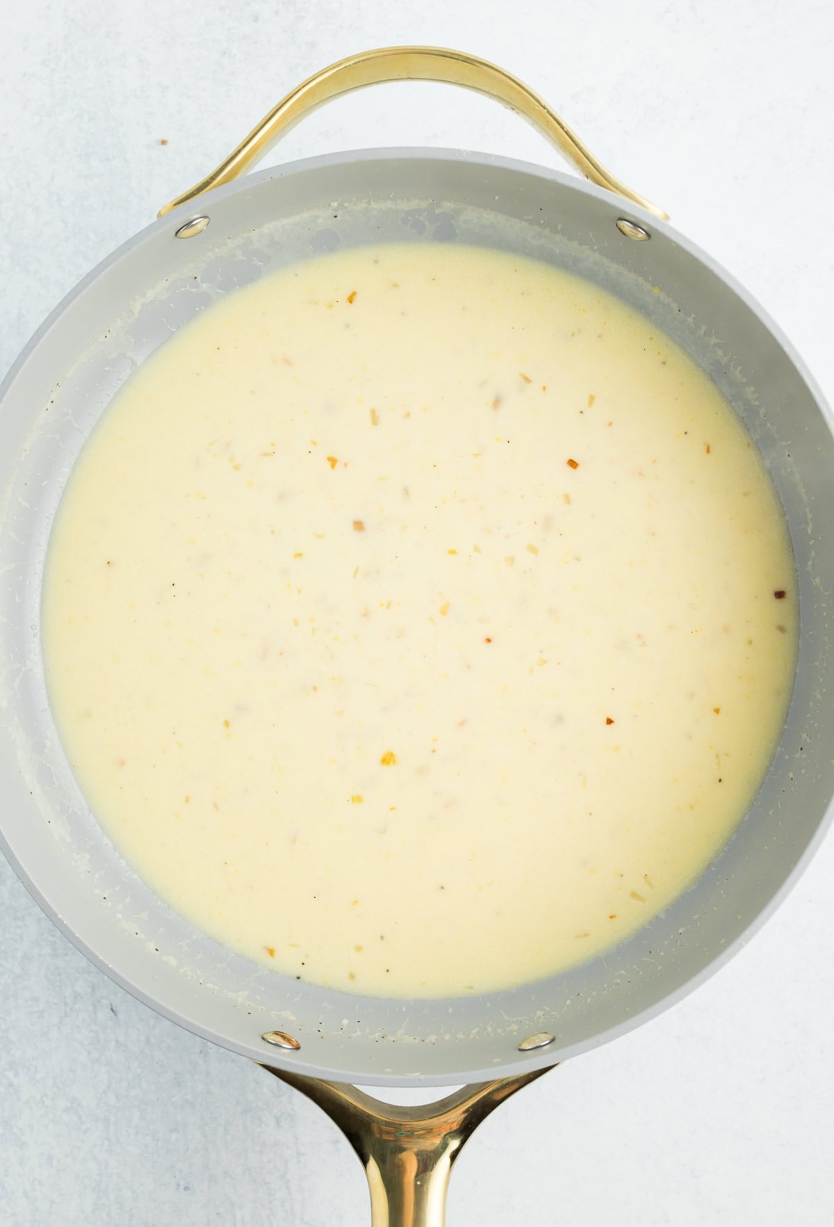 a homemade cream sauce in a skillet.