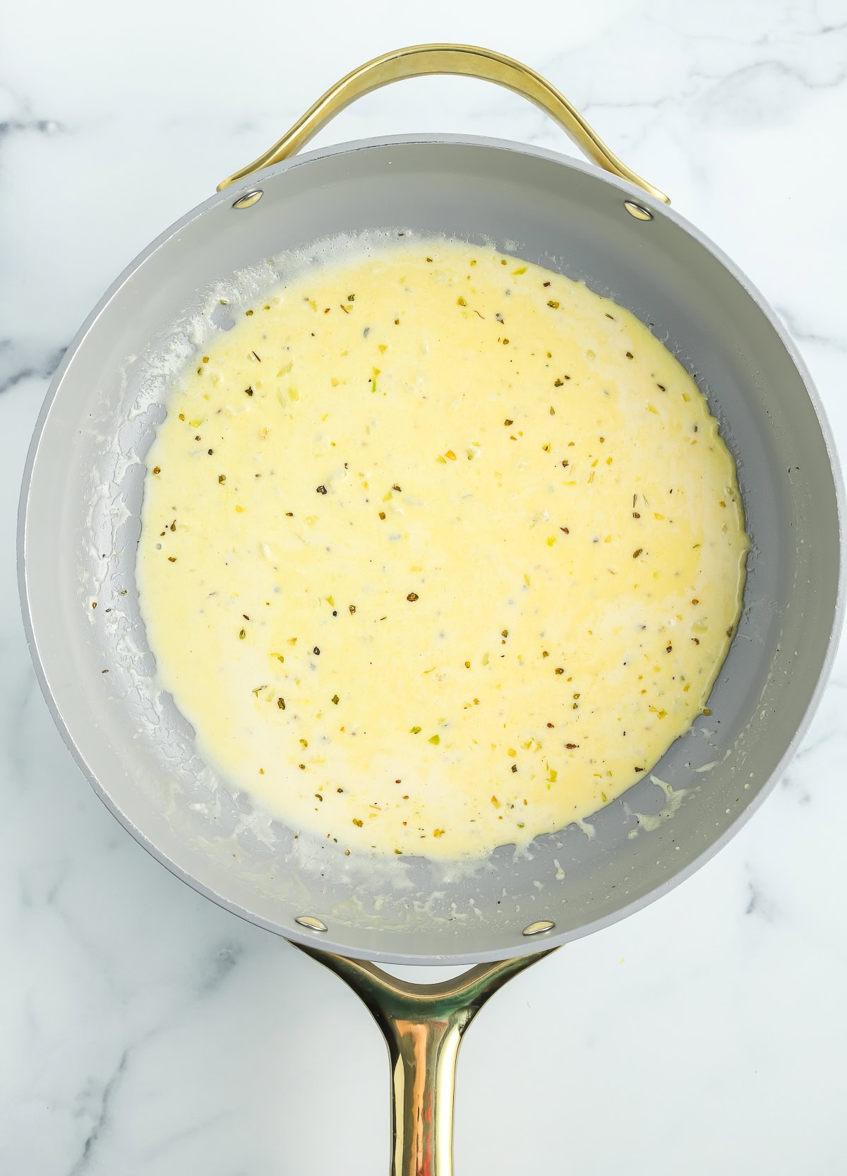 seasonings and heavy cream in a skillet.