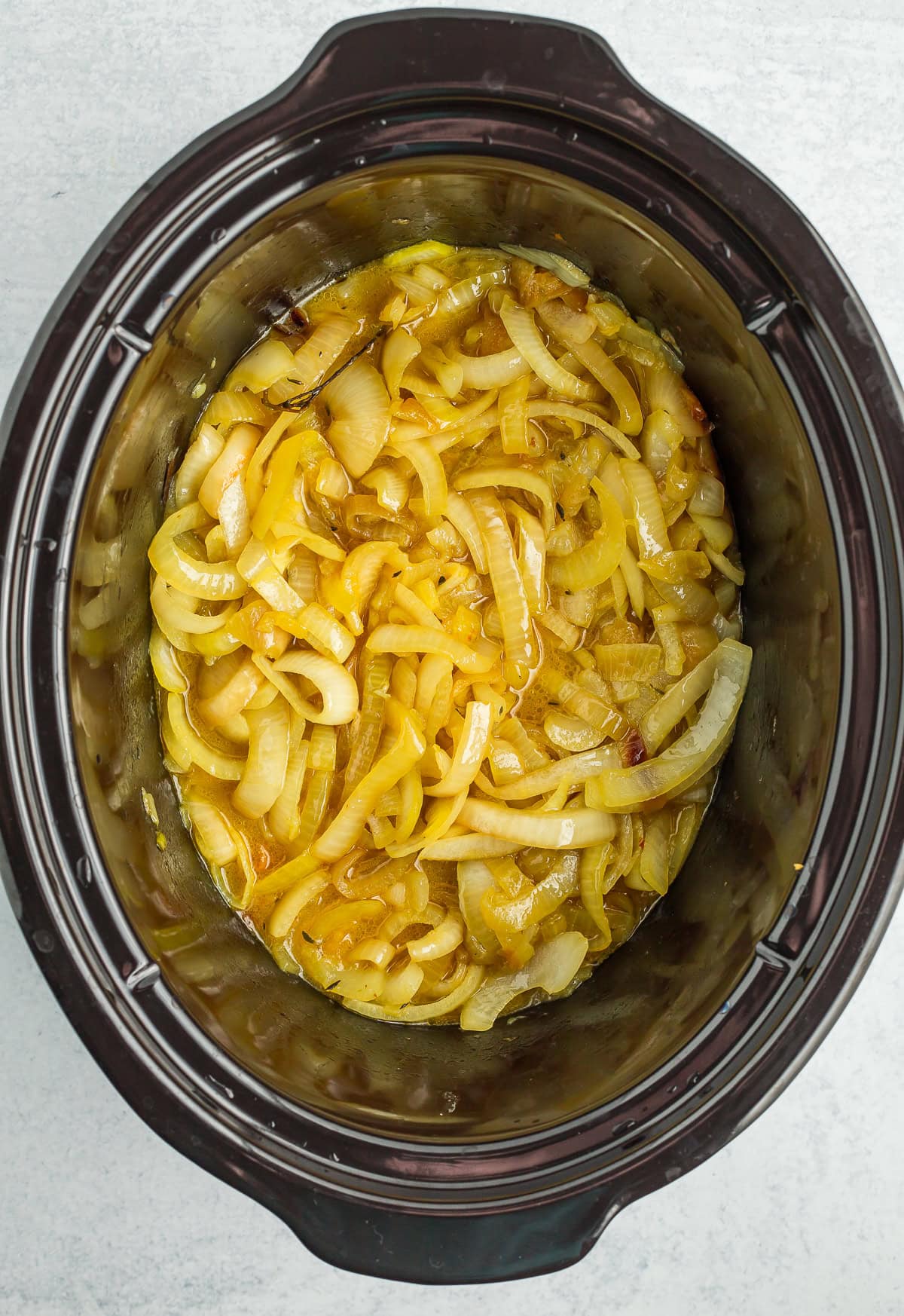 cooked onions in a crockpot.