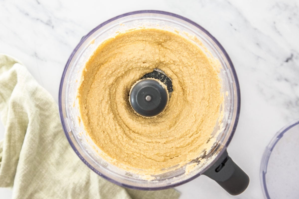 hummus being made in a food processor.