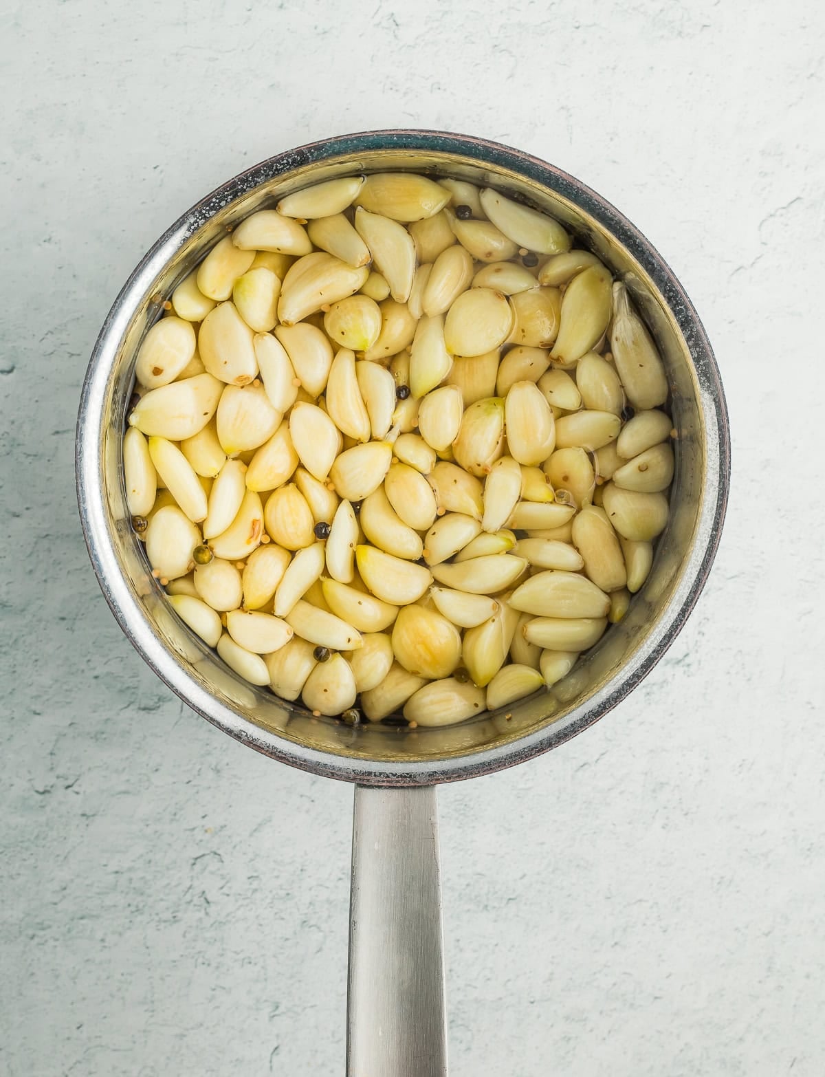 a saucepan of garlic cloves.