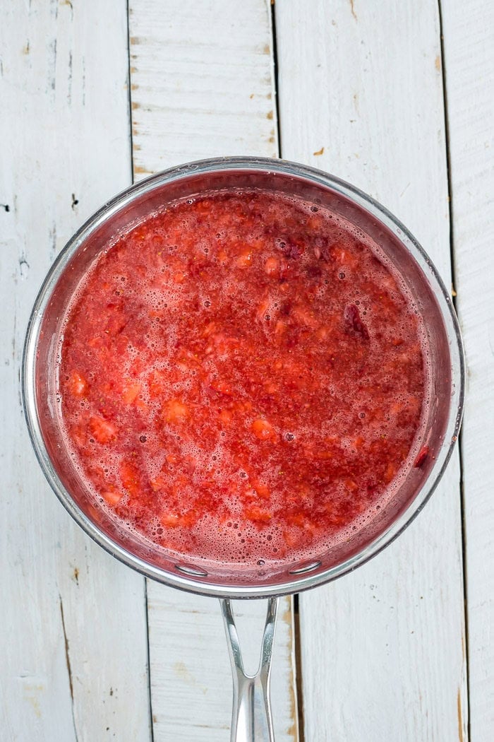 strawberry puree in a stainless saucepan.