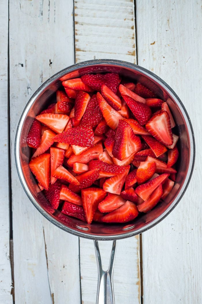 sliced strawberries in a saucepan.