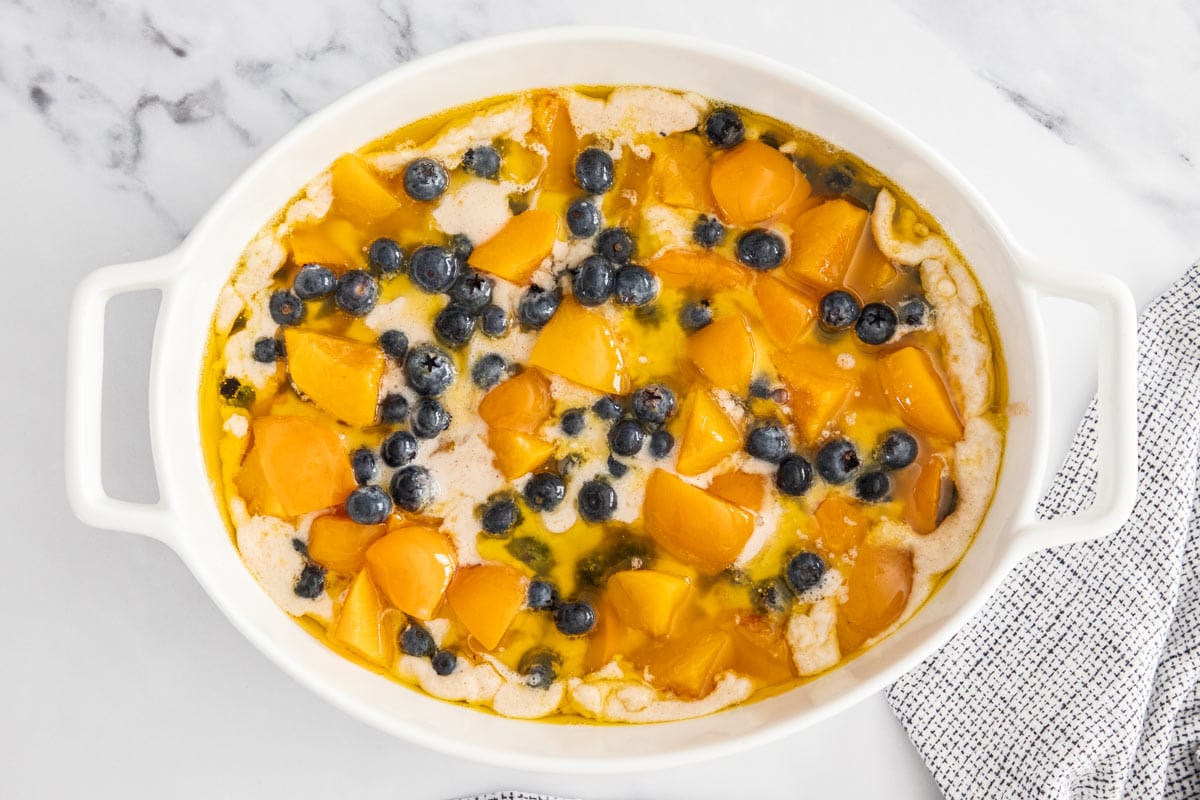 unbaked ingredients in a white backing dish.